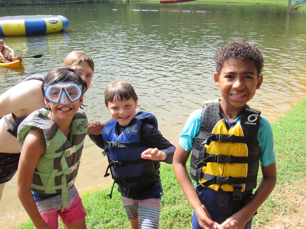 campers boating in the lake.jpg